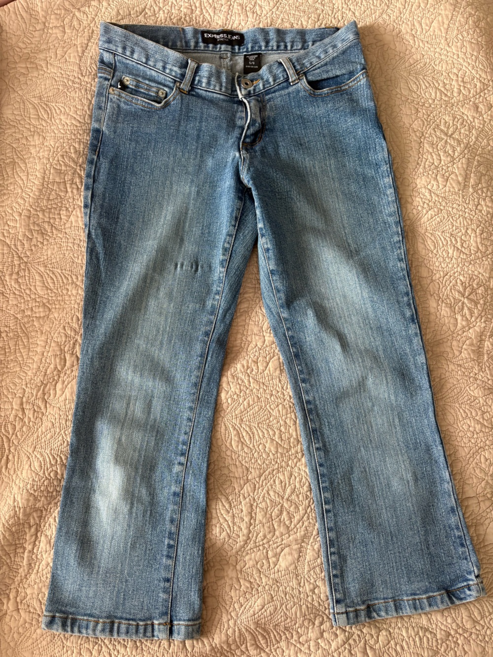 Express medium wash denim capri pants